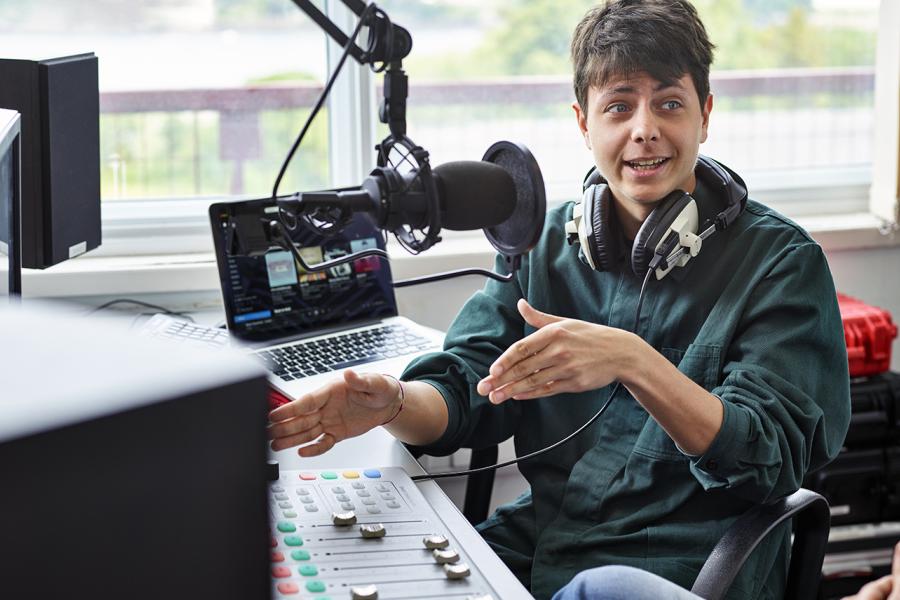 Student using the radio studio facilities at the the School of Music and Media