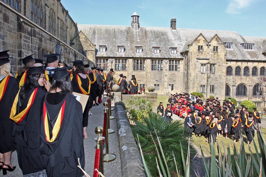 Students gather in the inner quad of the University's Main Arts building on graduation day